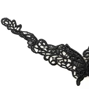 Macro view showing the intricate detail of black 3D hollow out water-soluble lace