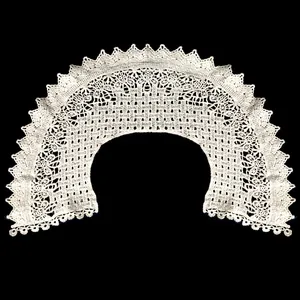 Close-up of white cotton embroidered hollow out lace detachable doll collar lapel