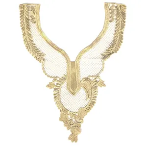 Macro detail of intricate gold thread embroidered lace collar with hollow floral patterns