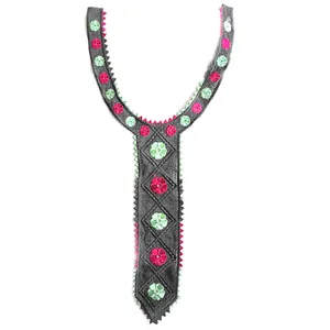 Detailed view of gray Y-shaped embroidered lace collar with pink and green floral patterns