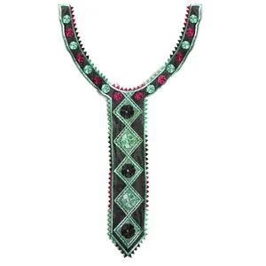 Detail view of Y-shaped embroidered lace collar applique with green and pink flowers