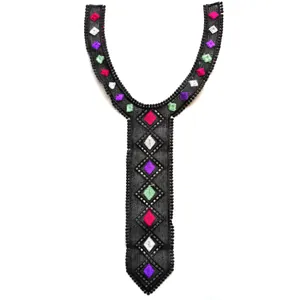 Close-up detail showing the intricate colorful diamond embroidery on black lace tie-shaped collar patch.