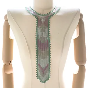 Close-up of a colorful embroidered lace collar featuring a unique necktie shape design