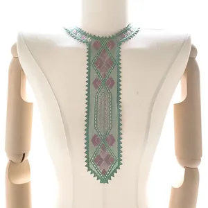 Detail of embroidered lace collar piece in tie shape with geometric floral patterns