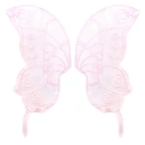 Macro detail of delicate pink lace butterfly embroidery patches for DIY garment crafts