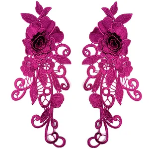 Detailed pair of 3D magenta lace floral appliques with intricate hollow embroidery pattern.