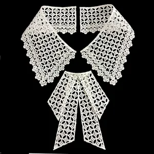 Close-up detail view of white water-soluble lace bow collar with intricate embroidery