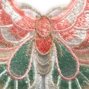 Detailed macro view of colorful butterfly embroidery patch with gold metallic thread details
