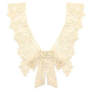 Close-up of elegant cream bow lace collar with water-soluble floral embroidery detail