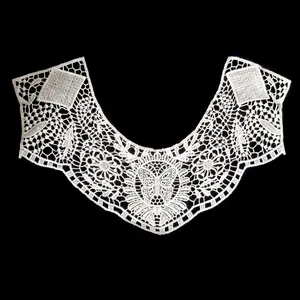 Detailed view of white water-soluble lace embroidered collar with butterfly motif