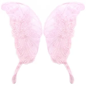 Close-up detail of pink embroidered lace butterfly wing patches for DIY sewing crafts