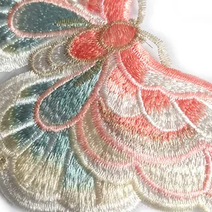 Macro view of detailed butterfly embroidery patch with metallic thread