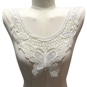 Close-up of white water-soluble lace fake collar with butterfly and hollow floral embroidery.