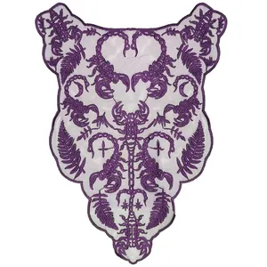 Detailed macro view of dark purple embroidered lace collar with scorpion pattern motifs