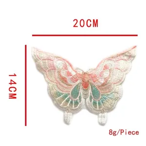 Macro view of a colorful embroidered butterfly patch with lace and organza details