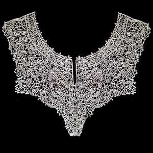Close-up of elegant cream embroidered water-soluble lace false collar for garments