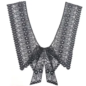 Detailed macro view of dark grey water-soluble milk silk embroidery lace collar with bow