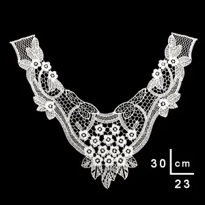 Detailed close-up of a white water-soluble embroidered lace collar with size measurements