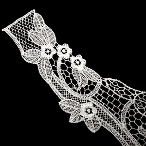 Close-up view of white water-soluble lace collar featuring delicate floral embroidery detail