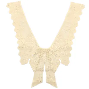 Detailed view of a beige lace detachable collar with floral water-soluble embroidery.
