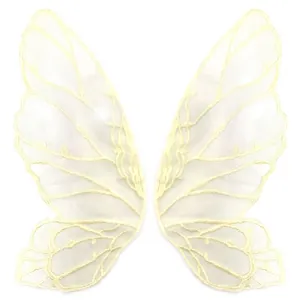 Close-up view of elegant beige embroidered butterfly wing lace patches for DIY crafts