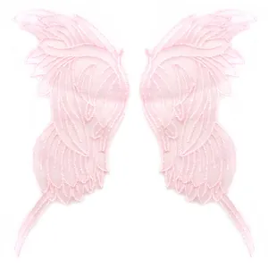 Close-up of pink lace embroidered butterfly wing patches with intricate mesh detail