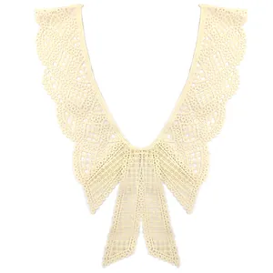Detailed close-up of cream butterfly lace collar with water-soluble embroidery texture