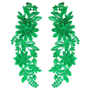Toppa ricamata in pizzo verde con design simmetrico