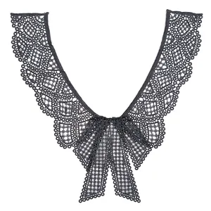Detailed view of black water-soluble lace false collar featuring an elegant bow design.