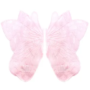 Close-up detail of symmetrical pink lace butterfly embroidery patches on mesh base