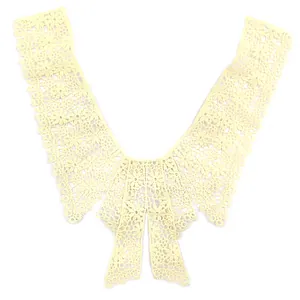 Close-up of elegant cream bow lace collar with water-soluble floral embroidery detail.