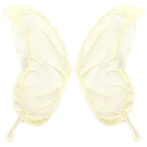 Detailed view of symmetrical lace butterfly embroidery patches on mesh base.