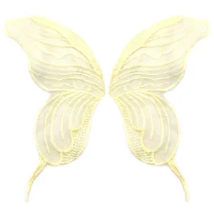 Detail of symmetrical beige butterfly lace embroidered patches for DIY clothing decoration