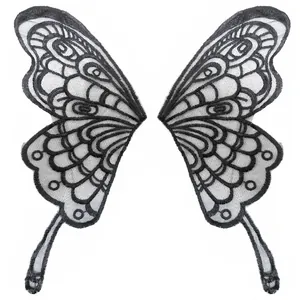 Detailed macro view showing the intricate black embroidered butterfly wing lace patches