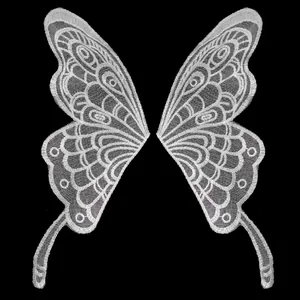 Detail view of white lace butterfly embroidery patches for DIY sewing and wedding crafts