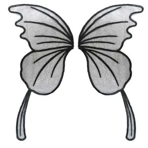 Close-up view of symmetrical black embroidered butterfly wing mesh lace patches