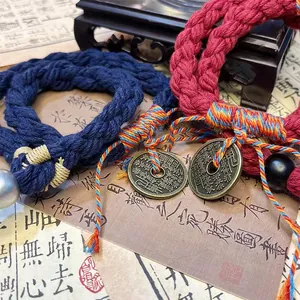 Close-up of hand-woven Shan Gui Hua Qian ethnic style rope bracelet details