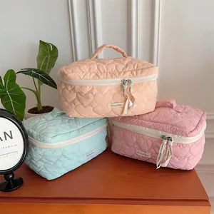 Quilted heart makeup bag large capacity portable travel cosmetic storage bag for daily use.