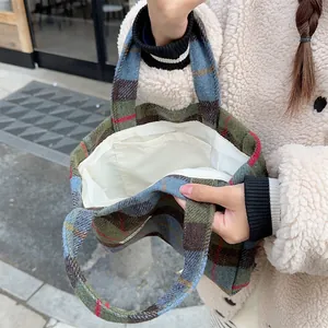 Retro plaid wool handbag interior detail showing fabric lining and pocket design for women.