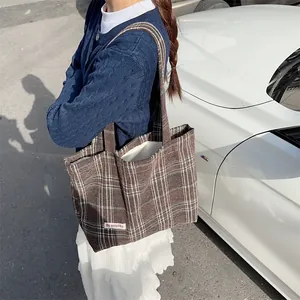 Brown plaid woolen tote bag detail, retro tweed shoulder bag with spacious interior design.