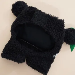 Black plush pet costume detail showing soft texture, cute ears, and leaf accent for dogs cats.