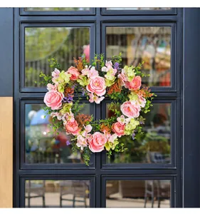 Heart-shaped artificial rose floral wreath detail, perfect for wedding and home wall decor.