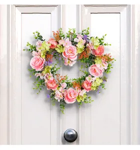 Heart shaped pink rose floral wreath detail, artificial flower hanging decor for home wedding.