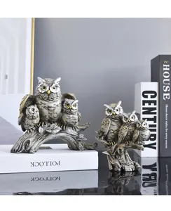 Macro view of vintage owl resin sculptures for creative home office decor