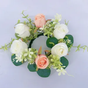 Detailed close-up of artificial eucalyptus rose candle ring wreath for home decor.