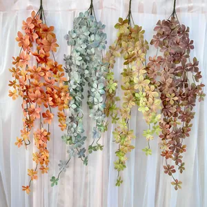 Artificial hanging flower vines wall decor plant, realistic cascading floral greenery for home.
