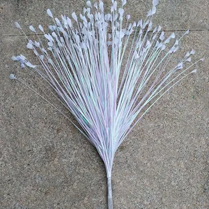 Close-up of iridescent white artificial peacock grass bundle for festive wedding decor