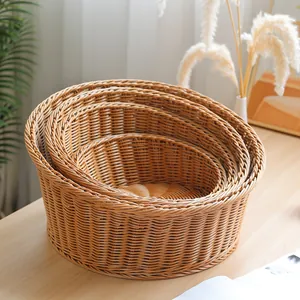 Hand-woven imitation rattan nested pet bed and storage basket set for all seasons use.