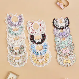 A variety of colorful floral lace pet bibs with bowknots for stylish cats and dogs