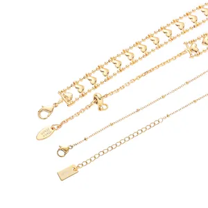Layered gold heart necklace set for women, delicate multi-strand choker chain jewelry fashion.